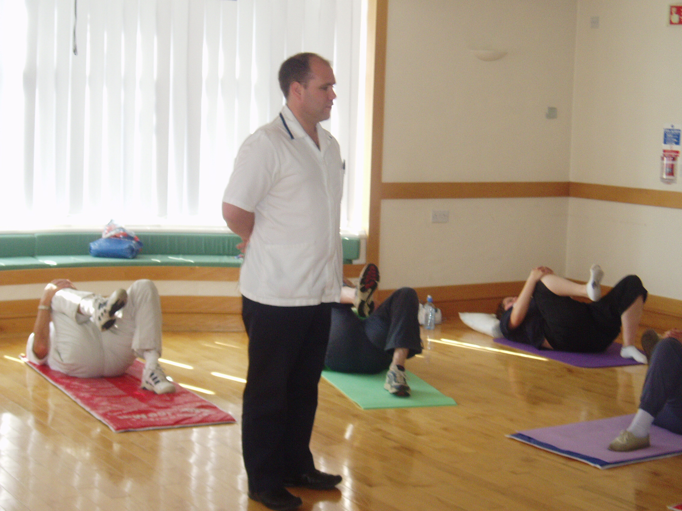 Picture of people taking part in a back exercise class